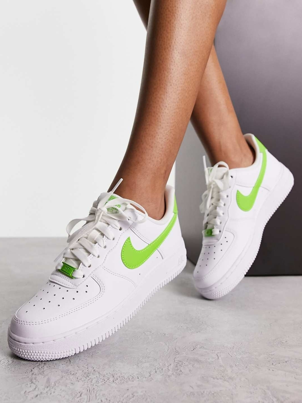 Nike Women's White Sneakers with Neon Green Swoosh